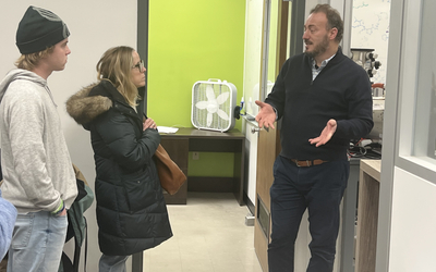 Emily and Will Burns speak with Bilal Alewi, assistant professor of pharmacology and toxicology at MSU. Courtesy: Chaz Hong.